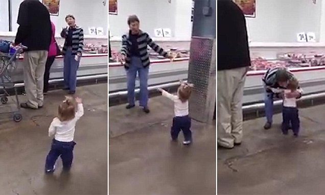 This little girl is making strangers` days 100% better by giving out hugs - VIDEO
